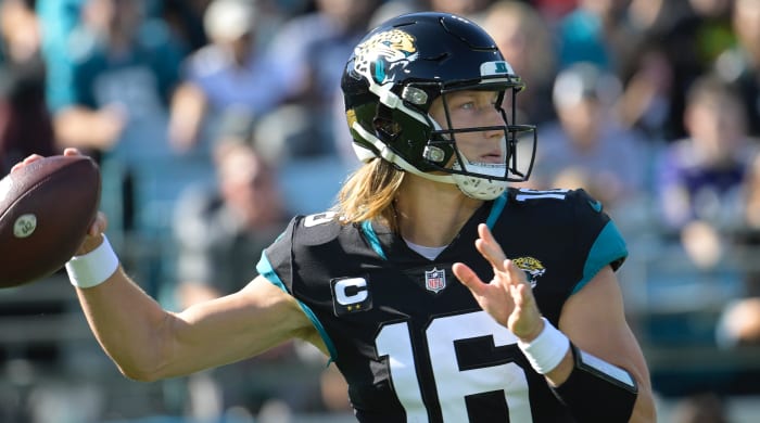 Jacksonville Jaguars quarterback Trevor Lawrence sets back to pass